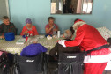Papai Noel cumprimentando eve