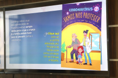 Imagem da cartilha na tela de uma televisão