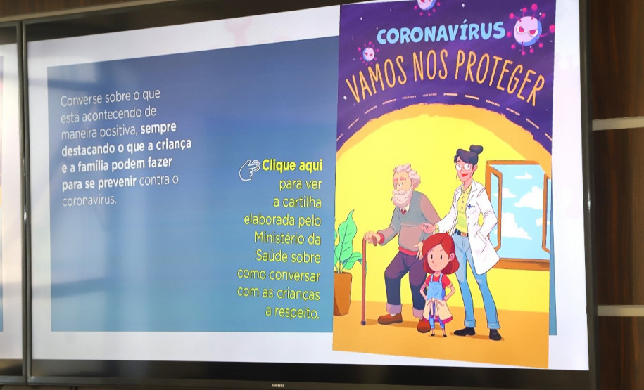 Imagem da cartilha na tela de uma televisão